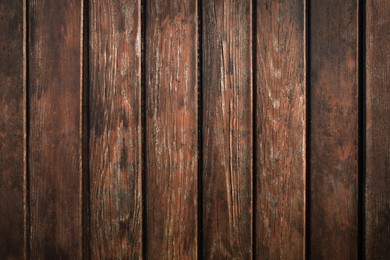 Photo of Texture of brown wooden planks as background