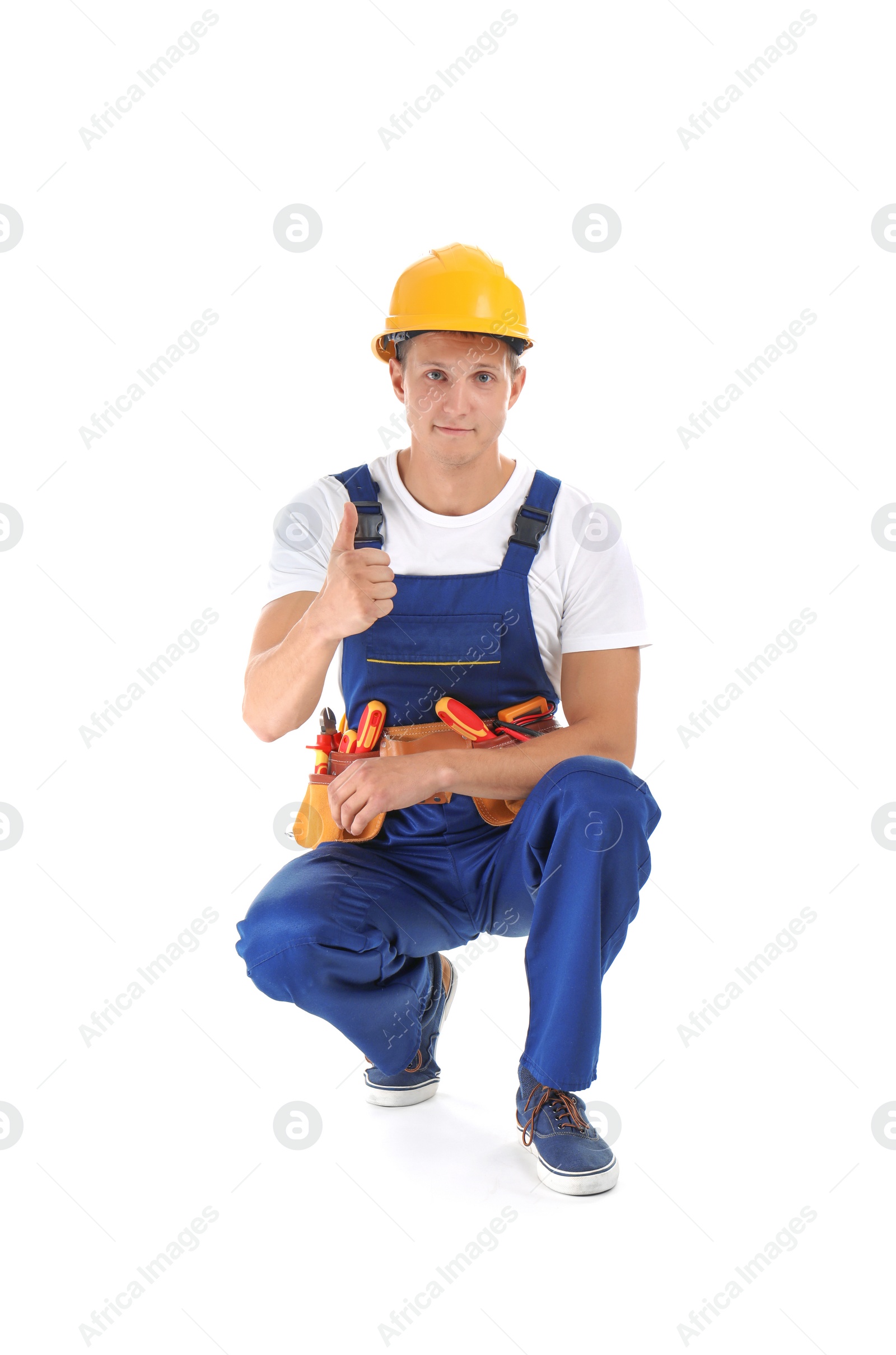 Photo of Electrician with tools wearing uniform on white background