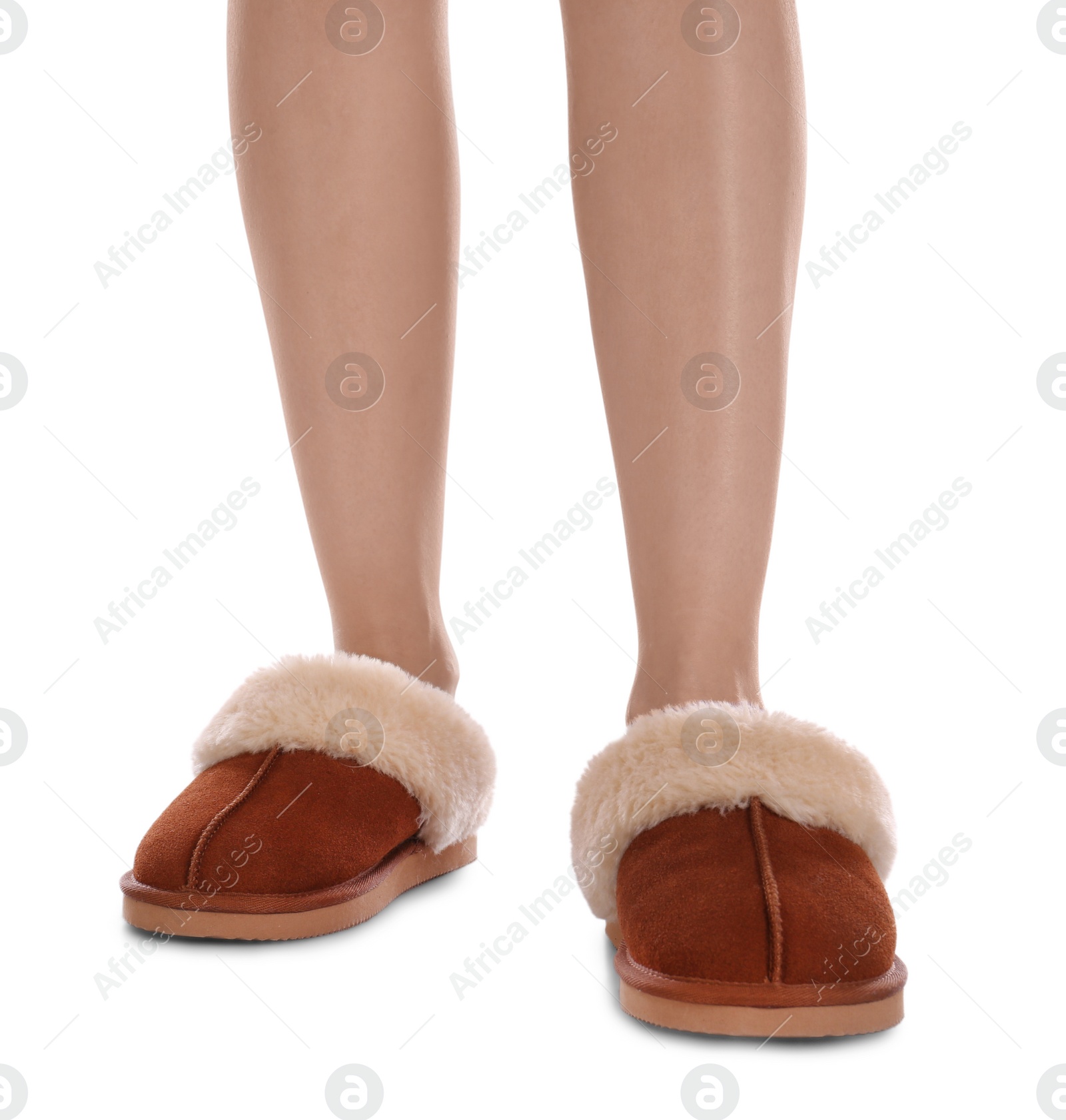 Photo of Woman in warm soft slippers on white background, closeup