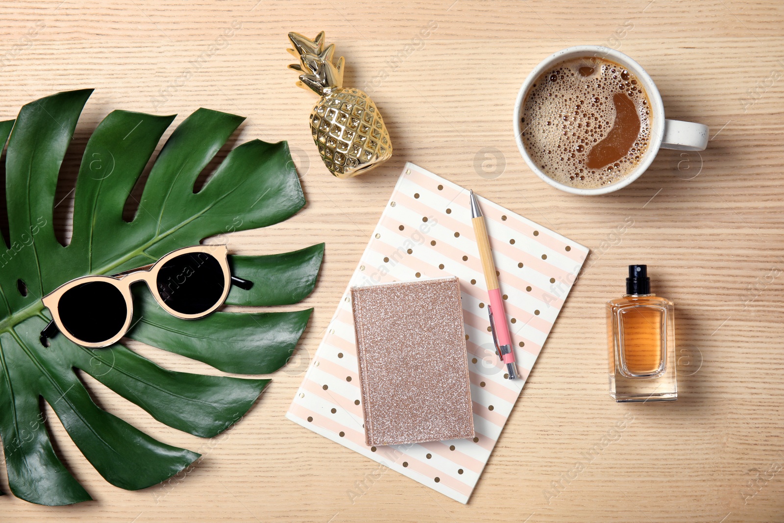 Photo of Flat lay composition with notebooks on wooden table. Blogger's workplace