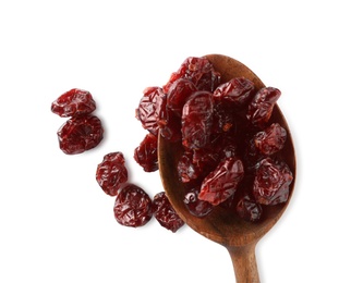 Photo of Dried cranberries and wooden spoon on white background, top view