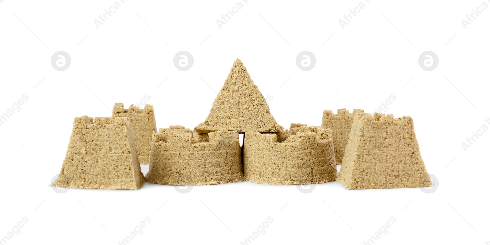 Photo of Beautiful sand castle isolated on white. Outdoor play