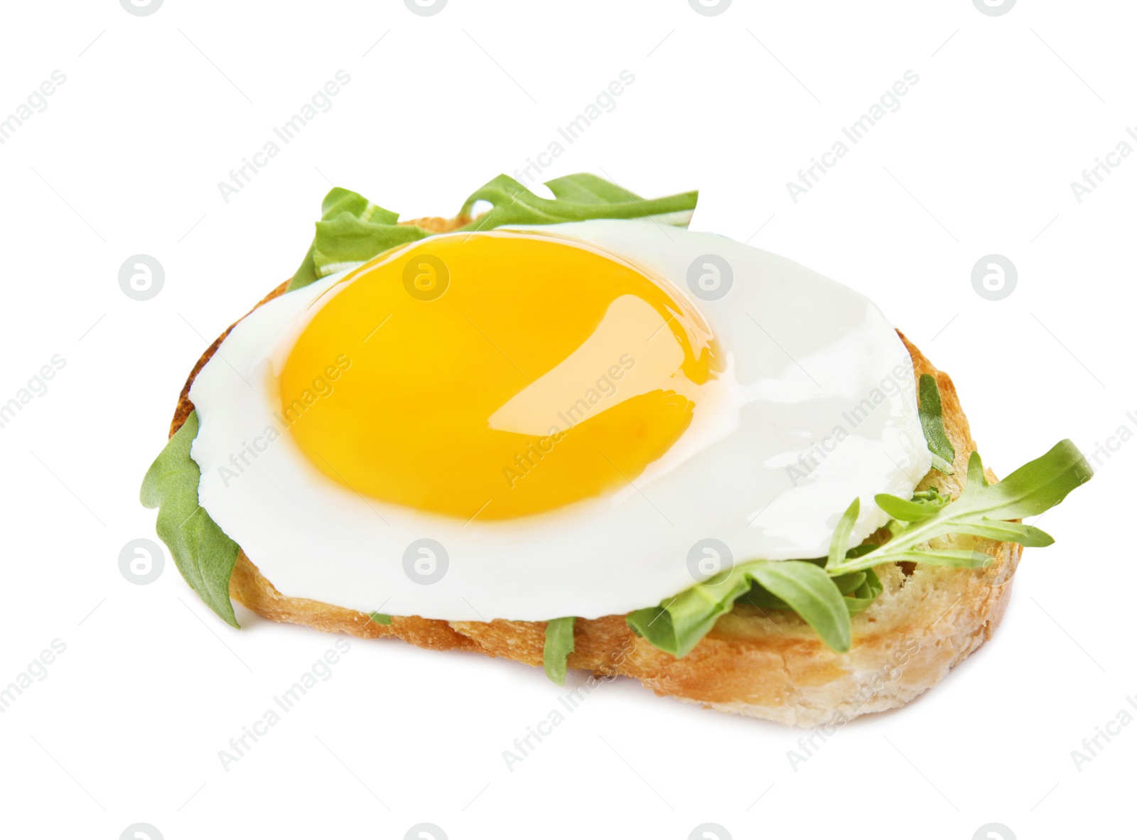 Photo of Slice of bread with fried egg and arugula on white background