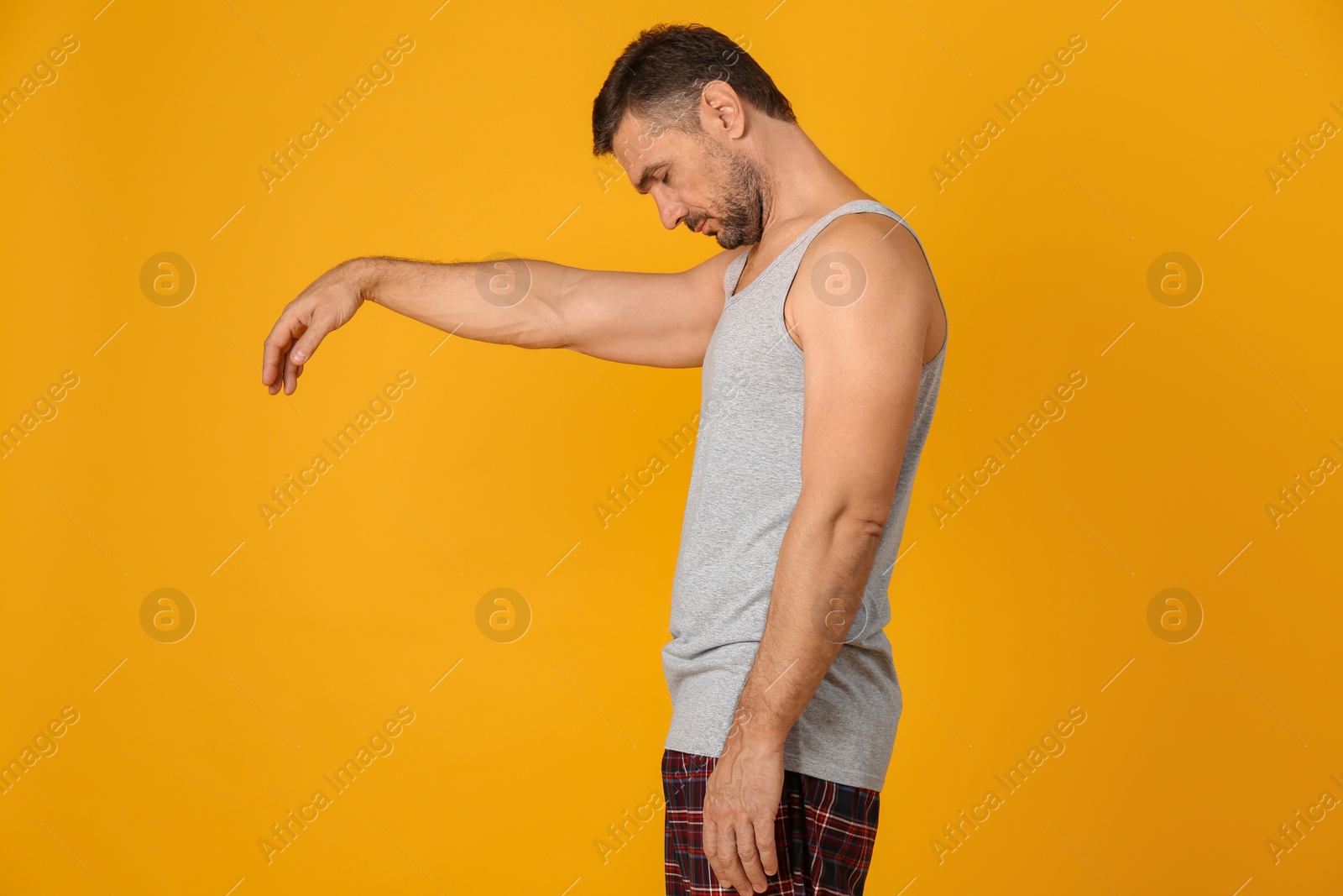 Photo of Man in sleepwalking state on yellow background