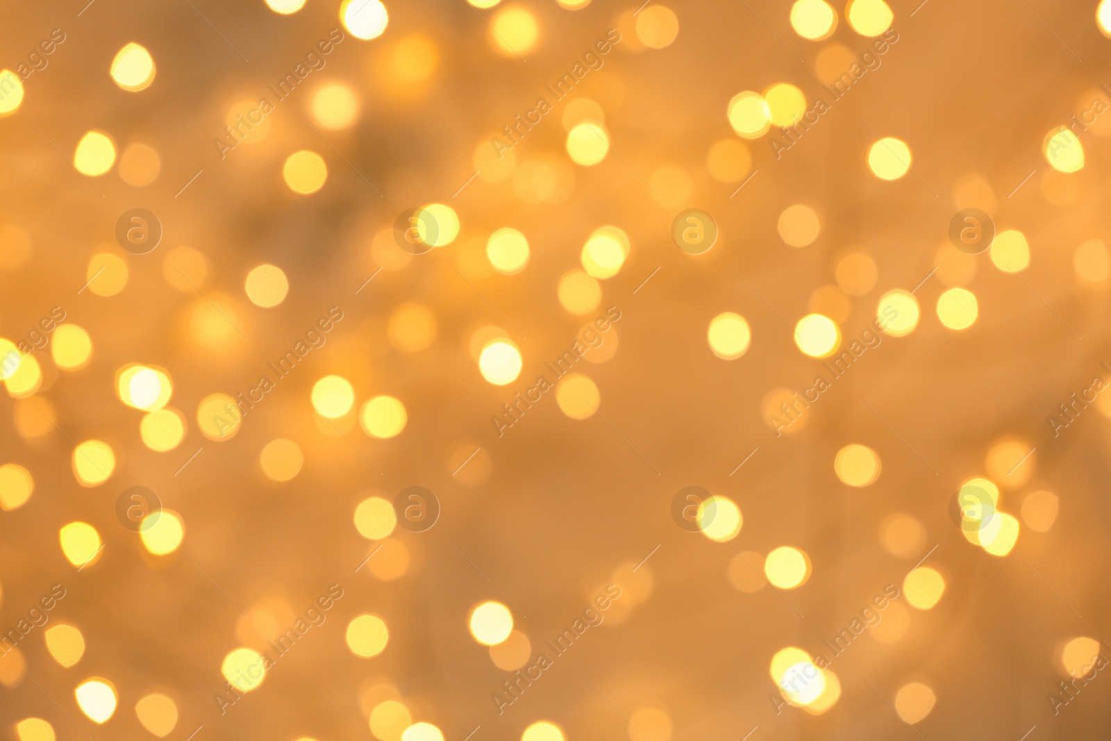 Photo of Beautiful golden lights as background. Bokeh effect