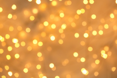 Photo of Beautiful golden lights as background. Bokeh effect