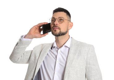 Photo of Businessman in glasses talking on smartphone against white background