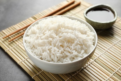 Photo of Bowl of tasty cooked rice served on table