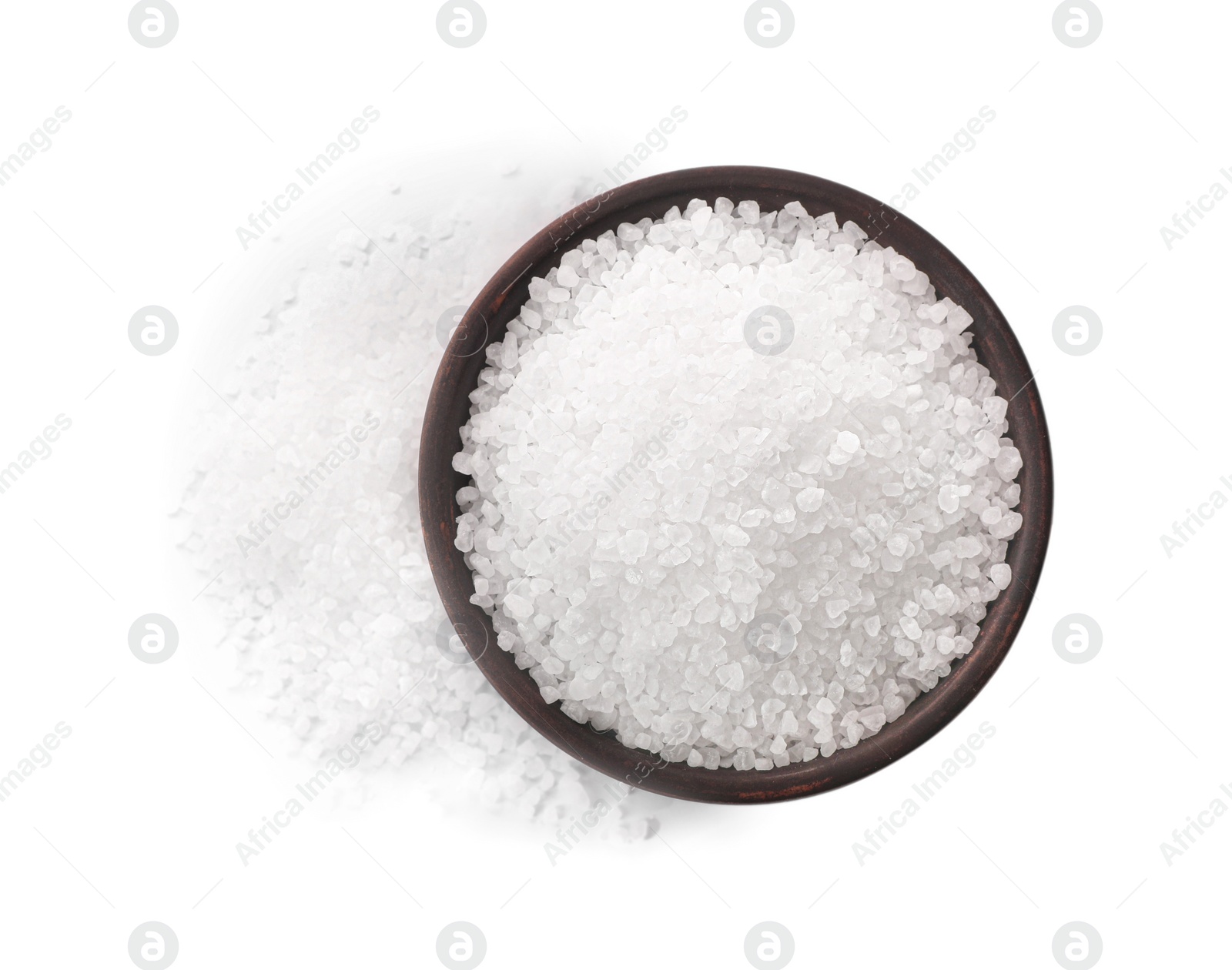 Photo of Natural salt in bowl isolated on white, top view