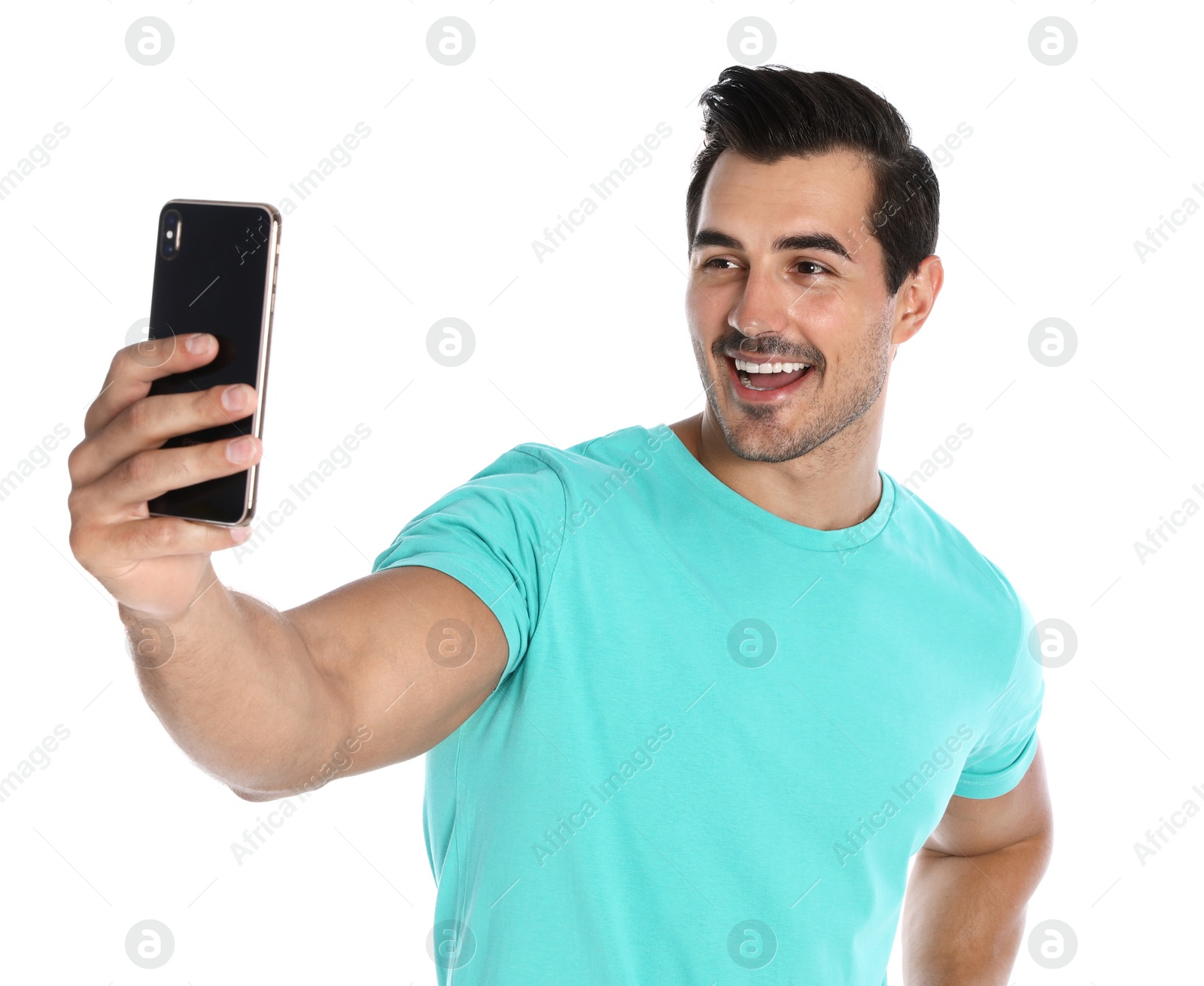 Photo of Happy young man taking selfie on white background