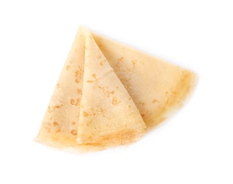 Photo of Tasty thin folded pancake on white background, top view