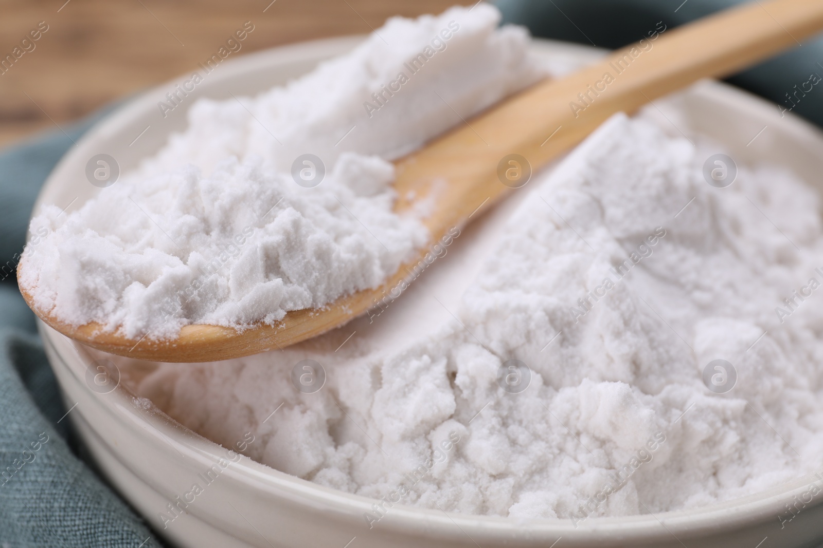 Photo of Bowl and spoon of natural starch, closeup