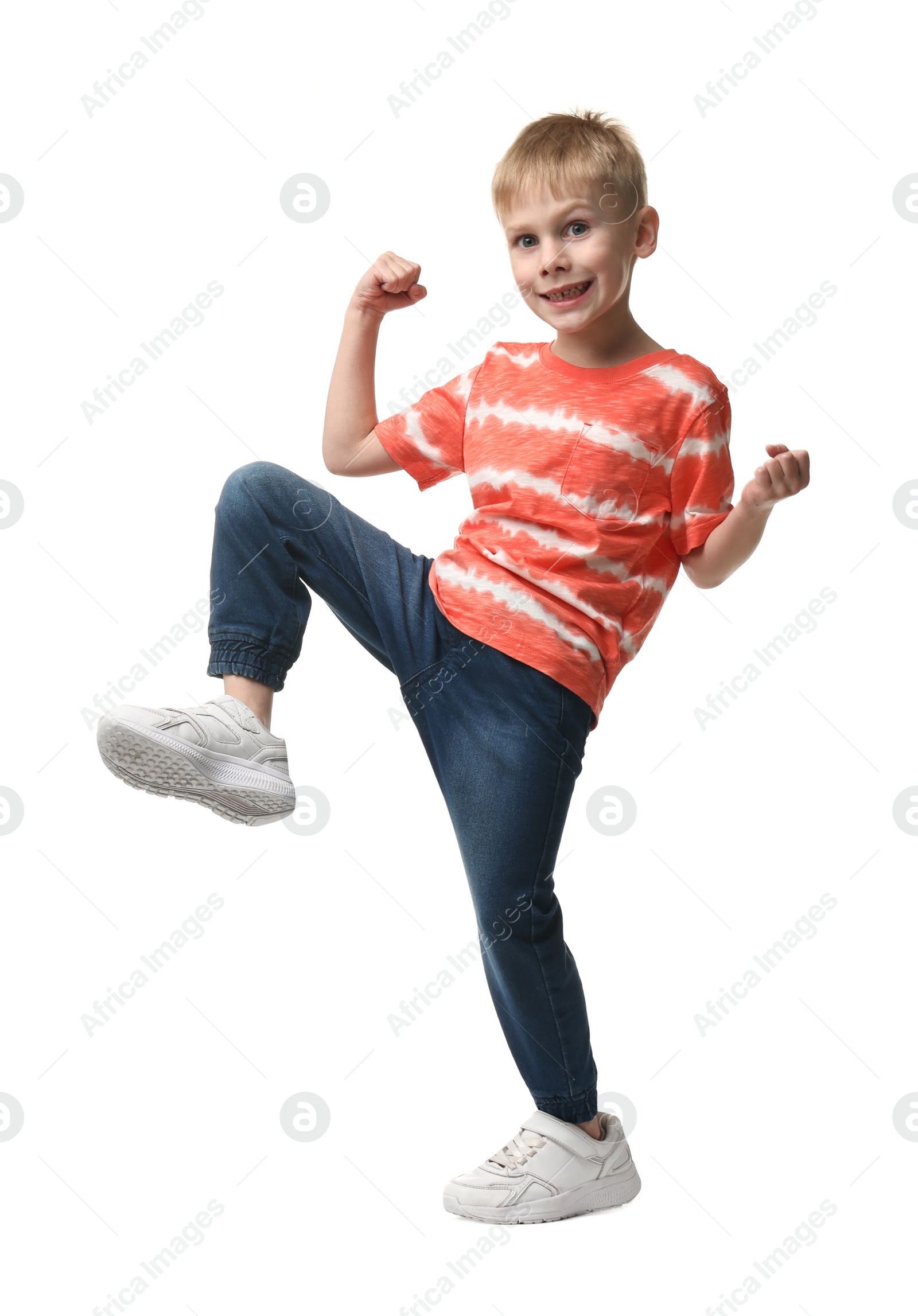 Photo of Happy little boy dancing on white background