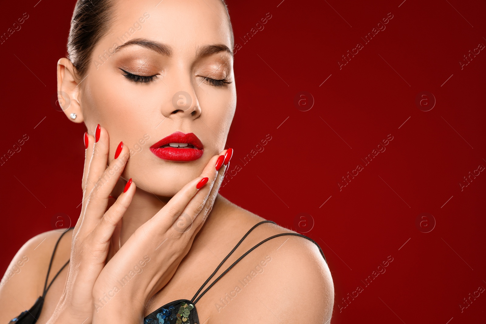 Photo of Beautiful young woman with bright manicure on color background, space for text. Nail polish trends