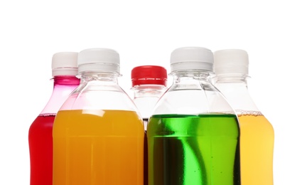 Photo of Bottles of soft drinks on white background, closeup