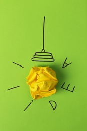 Photo of Composition with crumpled paper ball, drawing of lamp bulb and word IDEA on color background. Creative concept