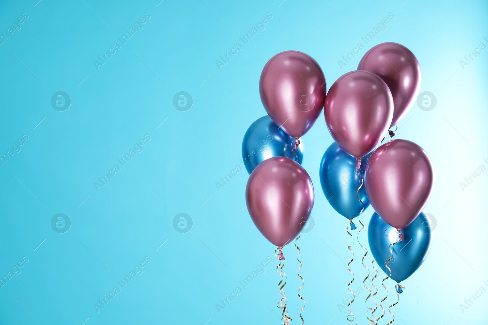 Photo of Bright balloons on color background. Space for text