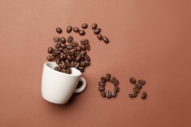 Photo of 0 percent made of coffee beans and cup on color background, flat lay. Decaffeinated drink