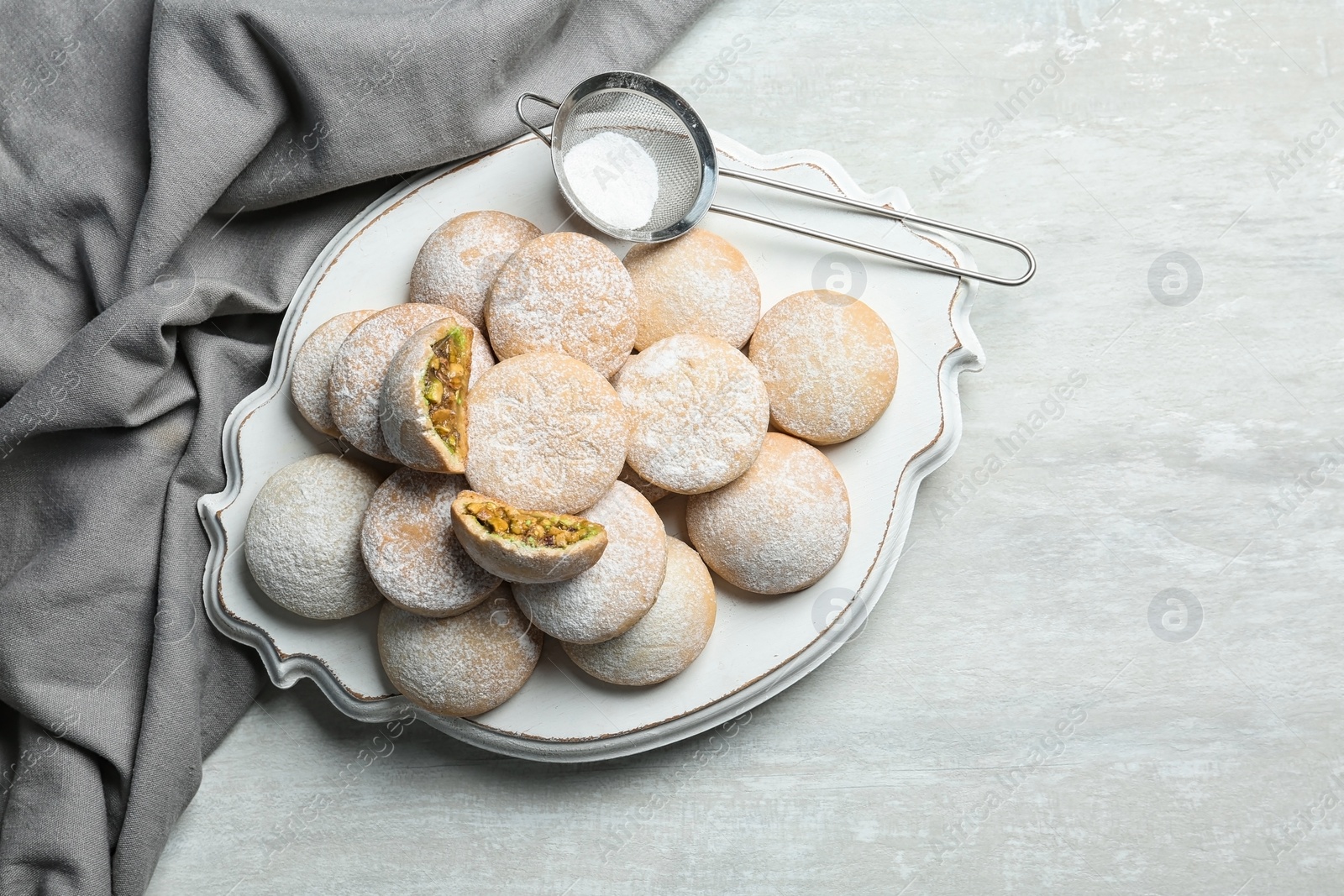 Photo of Traditional Islamic cookies on table, top view with space for text. Eid Mubarak