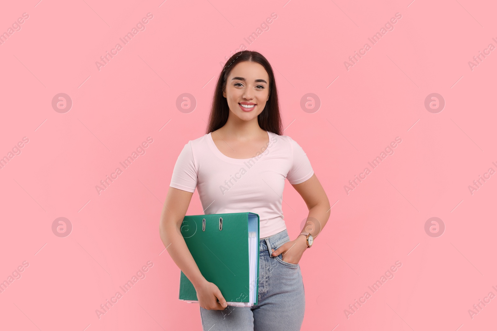Photo of Happy woman with folder on pink background