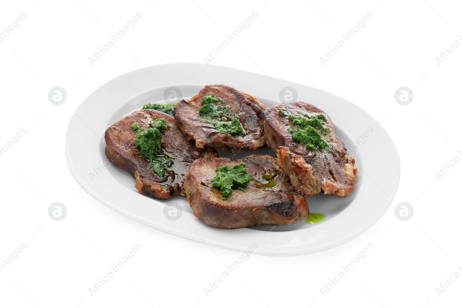 Photo of Tasty beef tongue pieces with salsa verde isolated on white