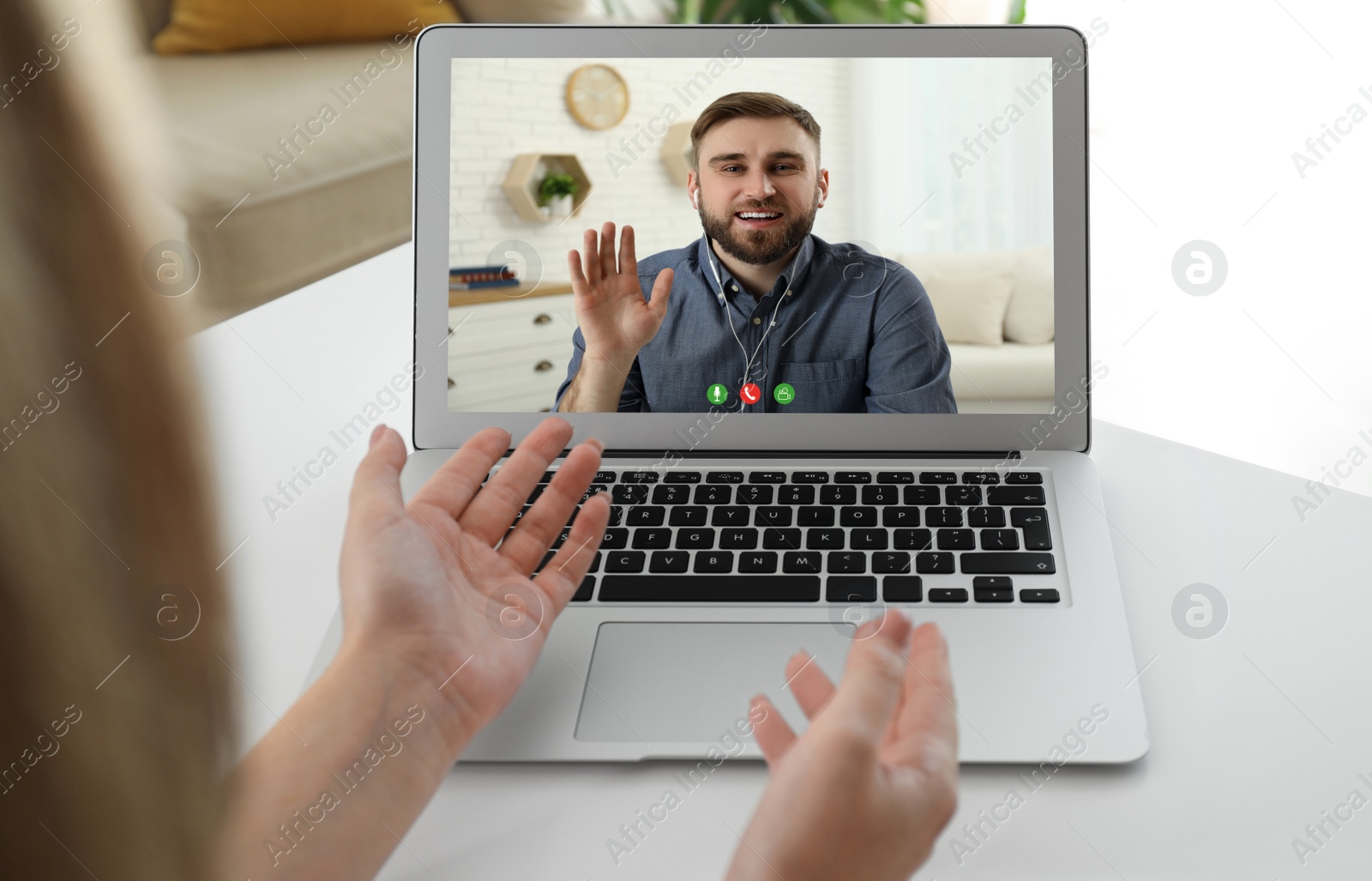 Image of Woman talking with handsome man using video chat on laptop at white table, closeup. Online dating