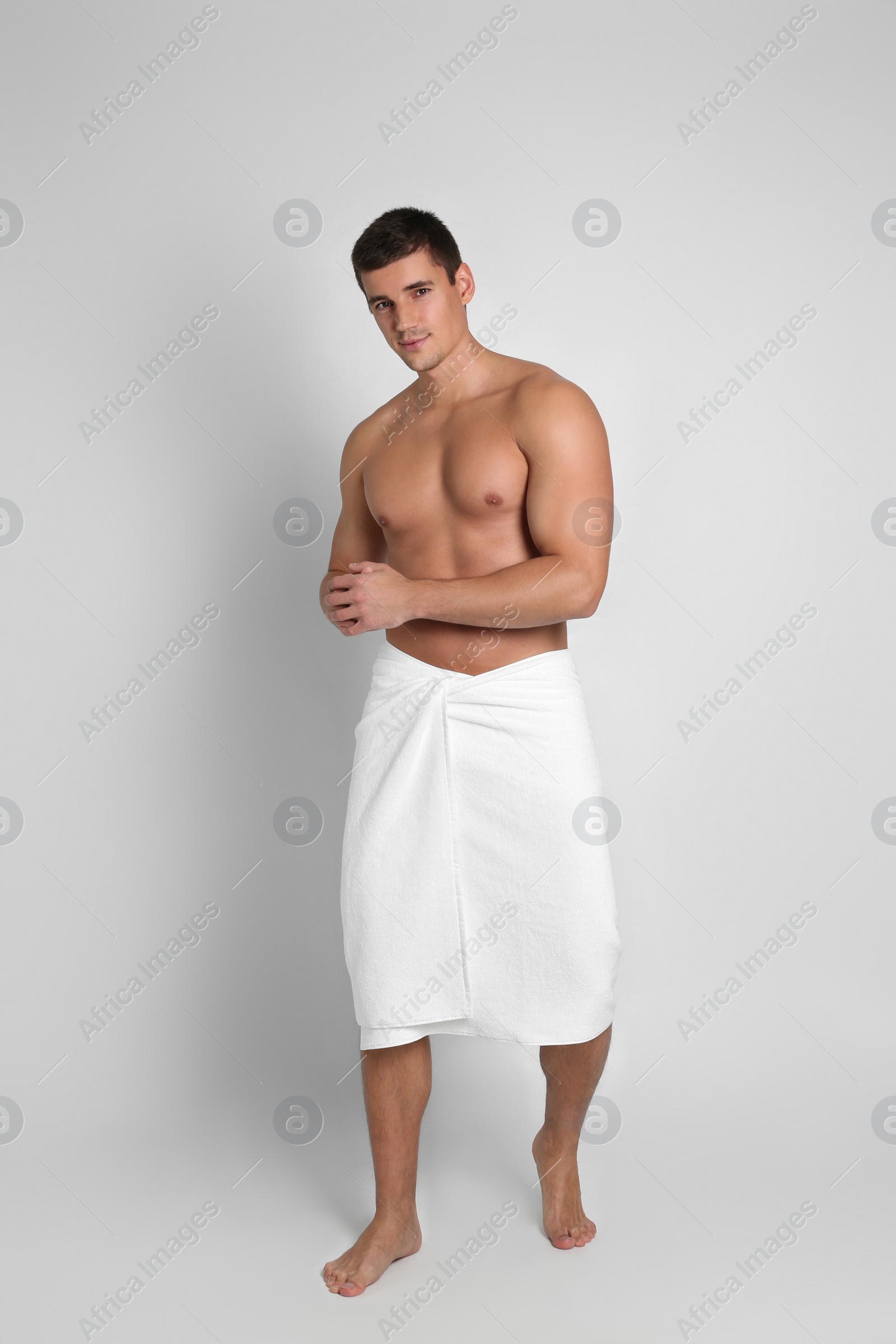 Photo of Man with sexy body on light background