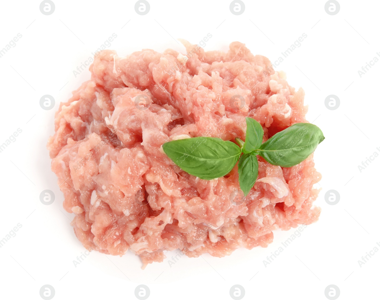 Photo of Pile of raw chicken minced meat with basil on white background, top view