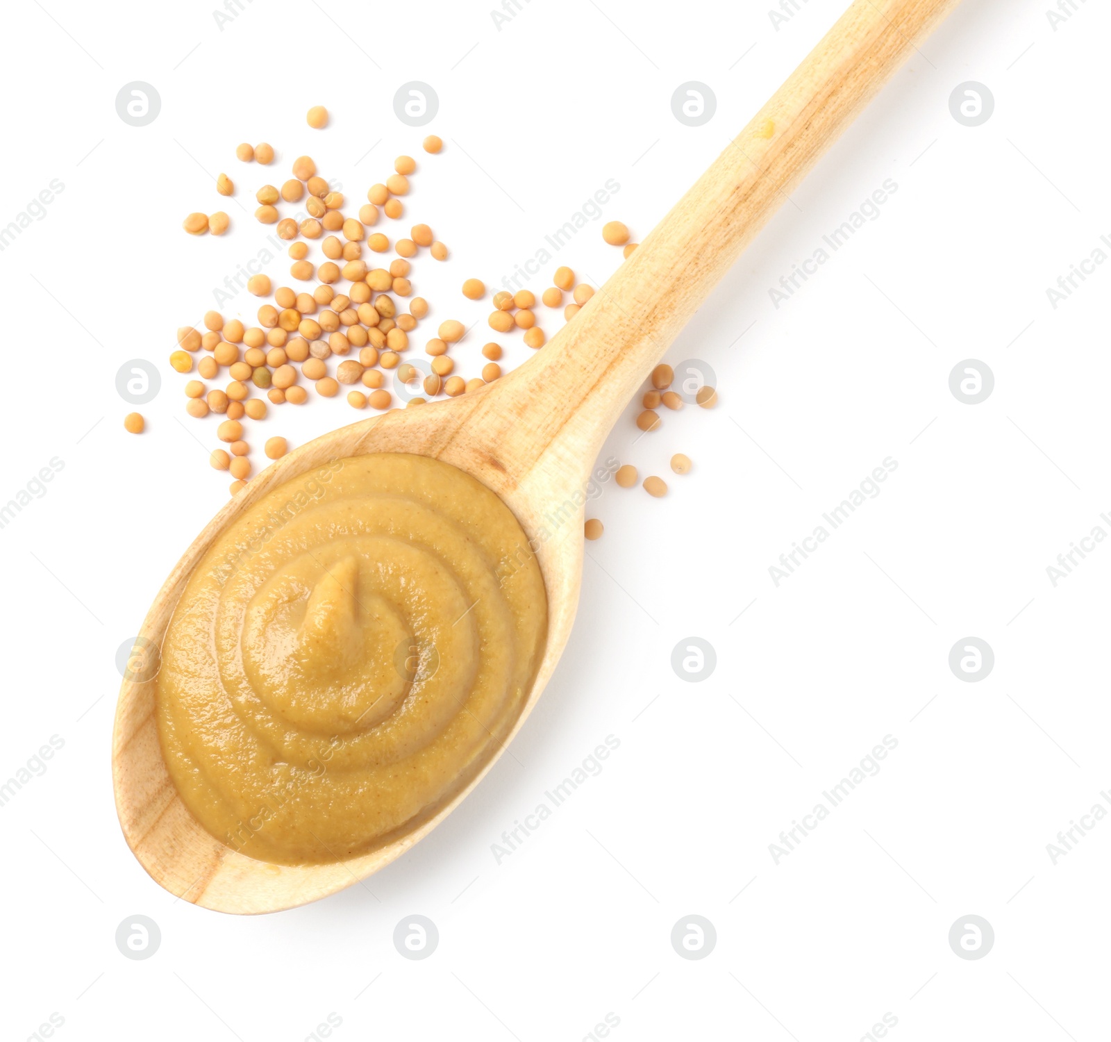 Photo of Fresh tasty mustard sauce in spoon and dry seeds isolated on white, top view