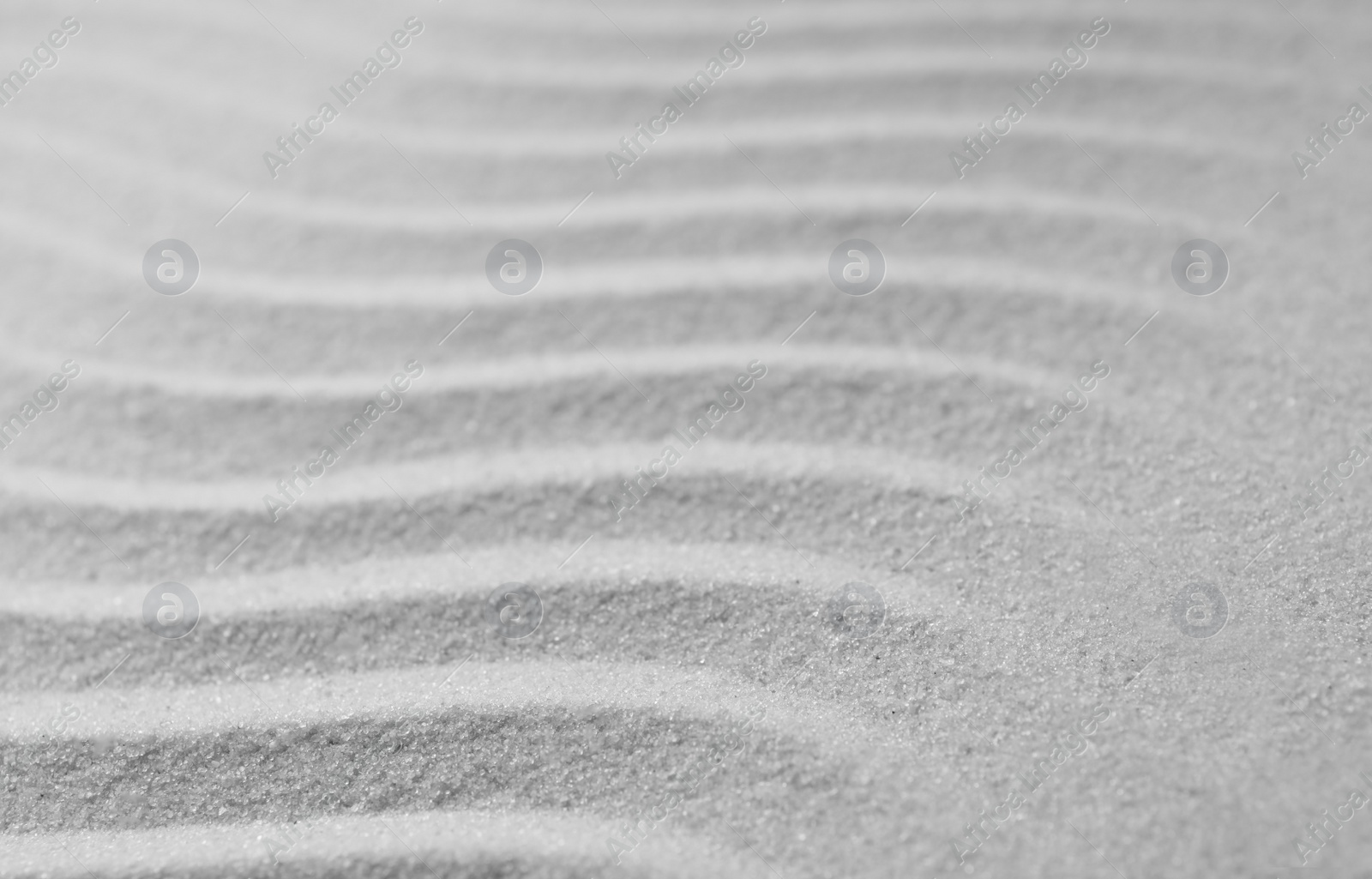 Photo of Zen garden pattern on sand. Meditation and harmony