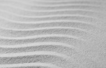 Photo of Zen garden pattern on sand. Meditation and harmony