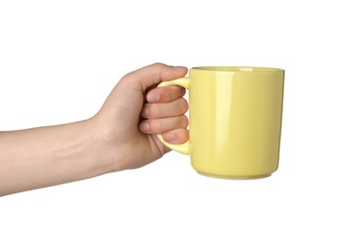 Photo of Woman holding yellow mug on white background, closeup