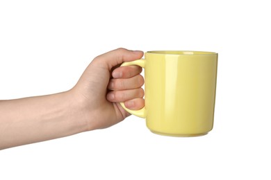 Woman holding yellow mug on white background, closeup