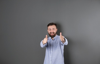 Portrait of handsome bearded man on color background