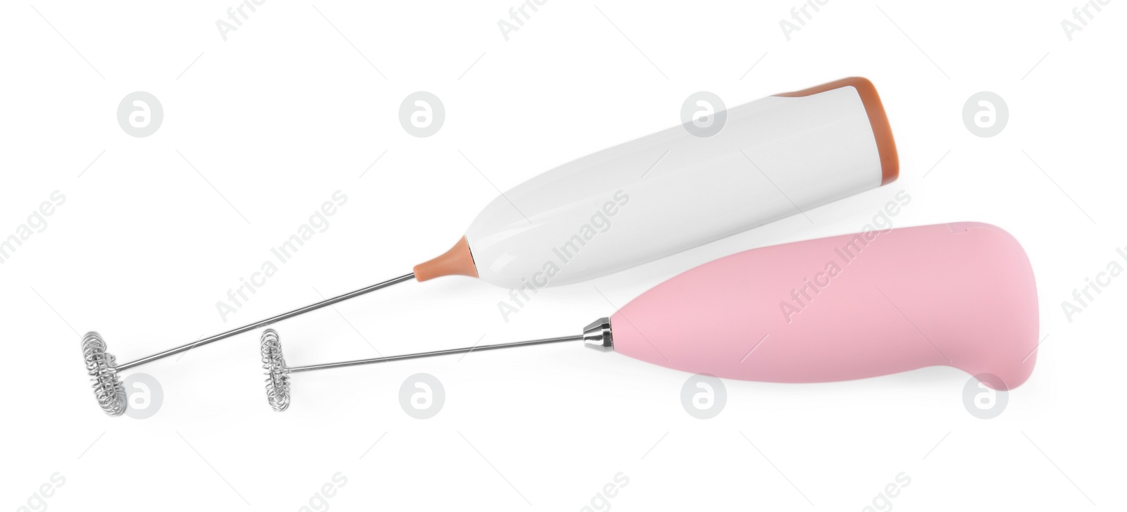 Photo of Two milk frother wands isolated on white, top view