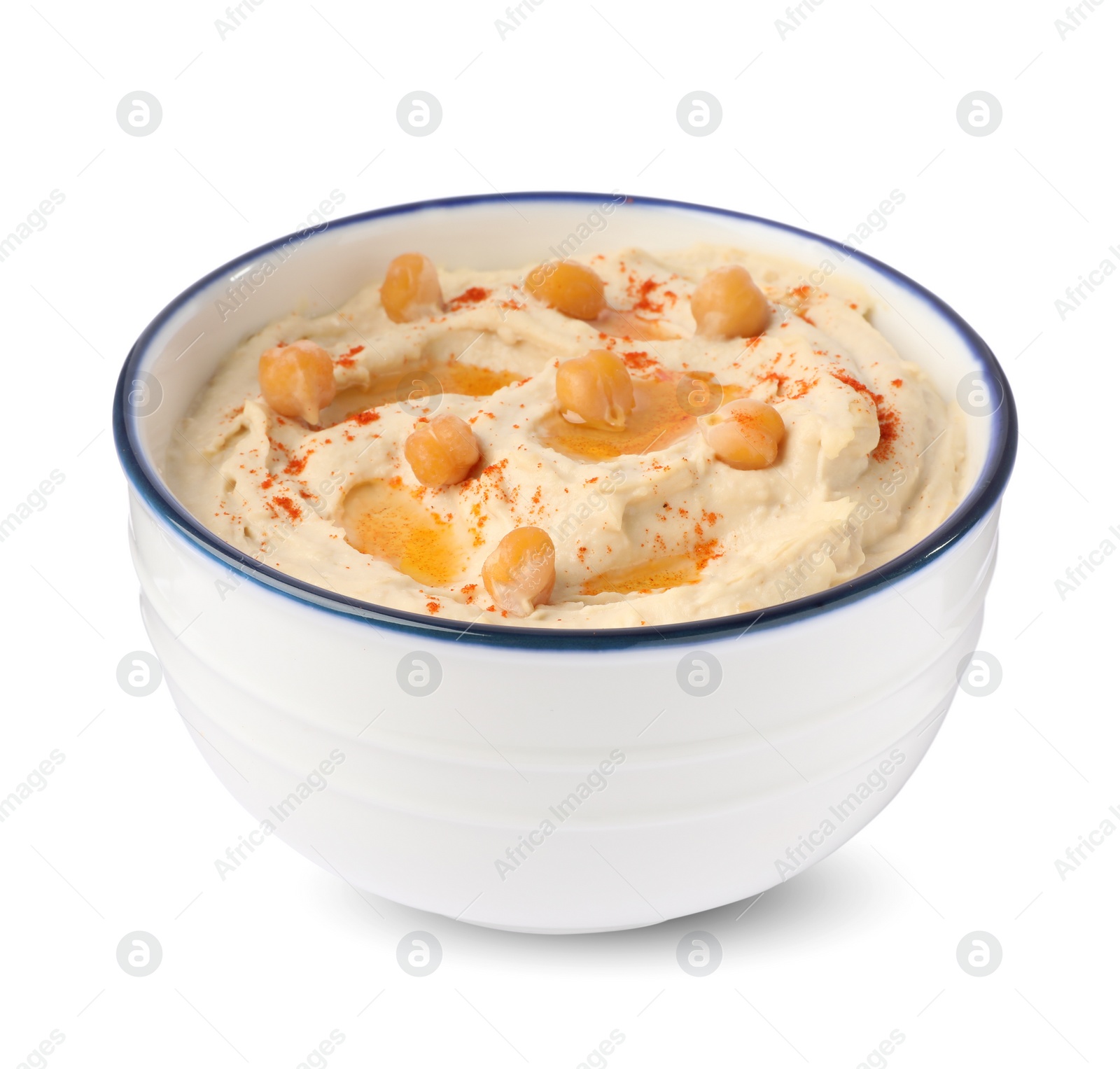 Photo of Bowl of tasty hummus with chickpeas and paprika isolated on white