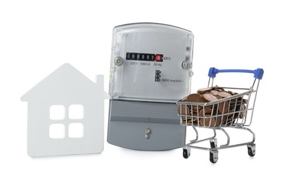 Electricity meter, house model and small shopping cart with coins on white background