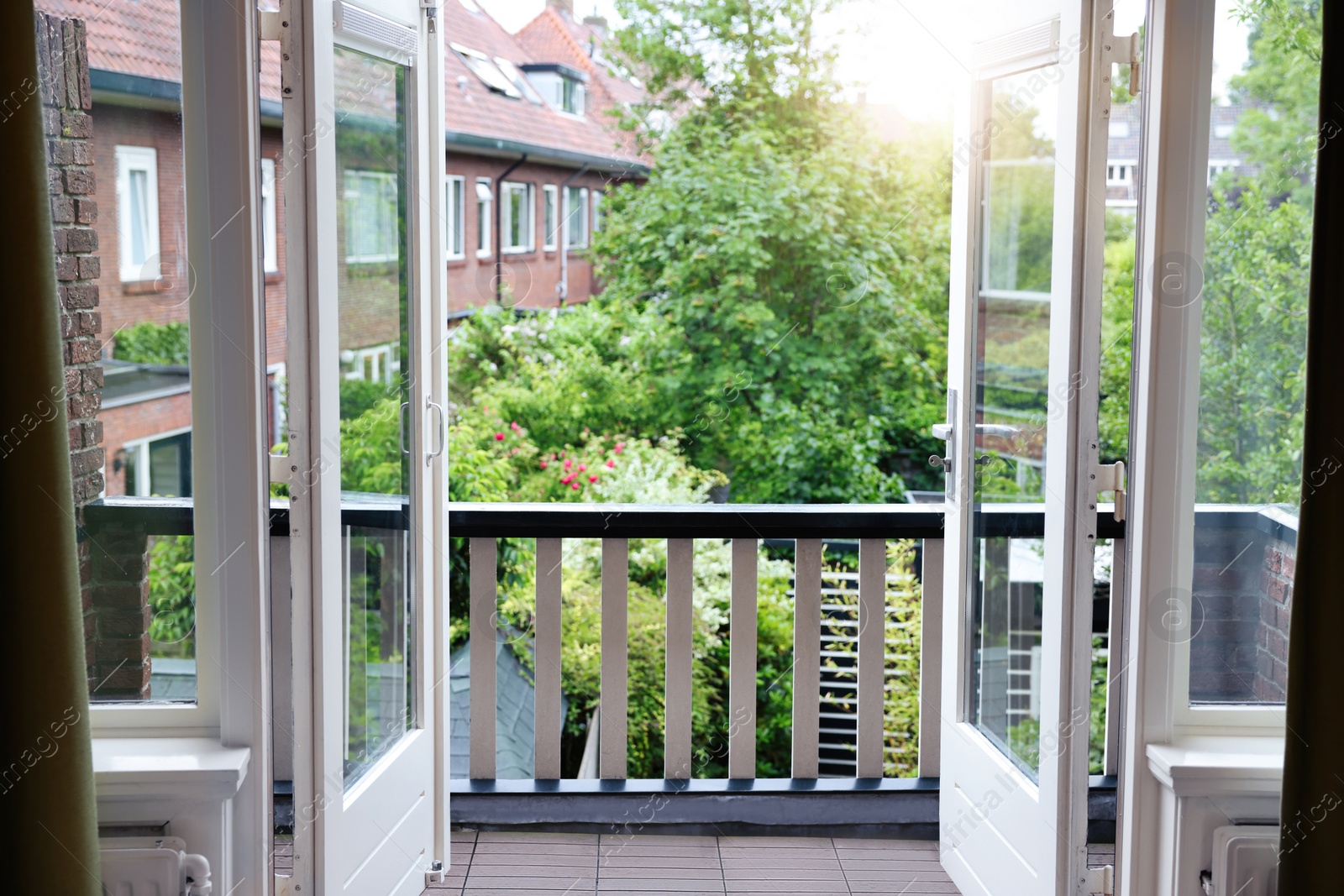 Photo of Beautiful view on balcony and inner yard with green trees from apartment