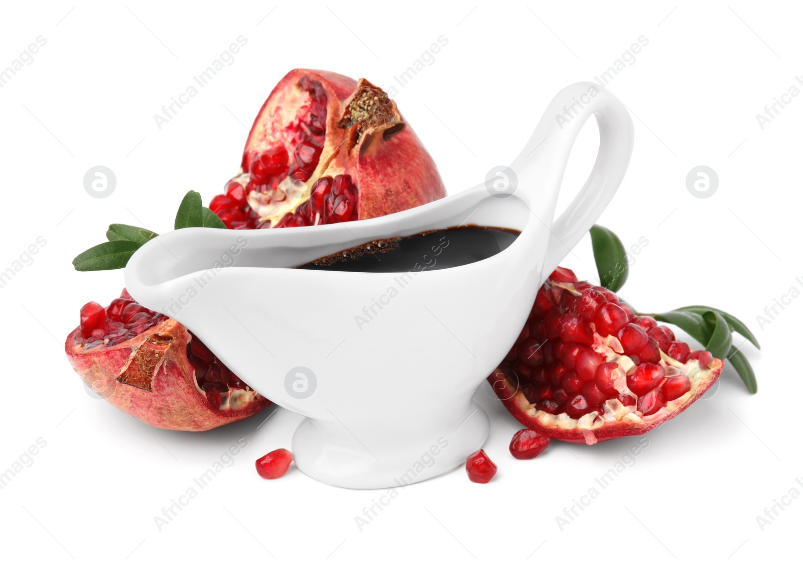 Photo of Tasty pomegranate sauce, fruits and branches isolated on white