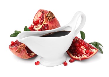 Photo of Tasty pomegranate sauce, fruits and branches isolated on white