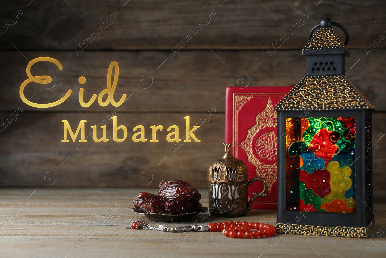 Image of Eid Mubarak greeting card. Composition with Arabic lantern and Quran on wooden table