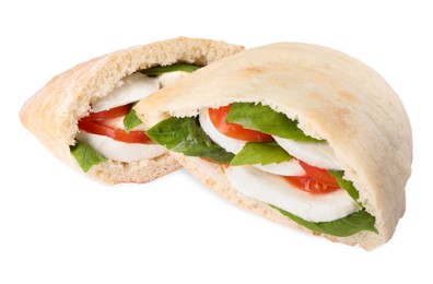 Delicious pita sandwiches with cheese, tomatoes and basil isolated on white