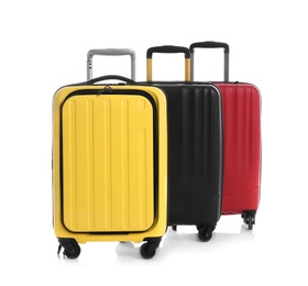 Modern suitcases for travelling on white background