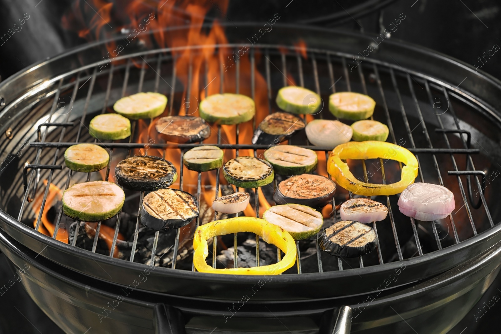 Photo of New modern barbecue grill with different vegetables, closeup