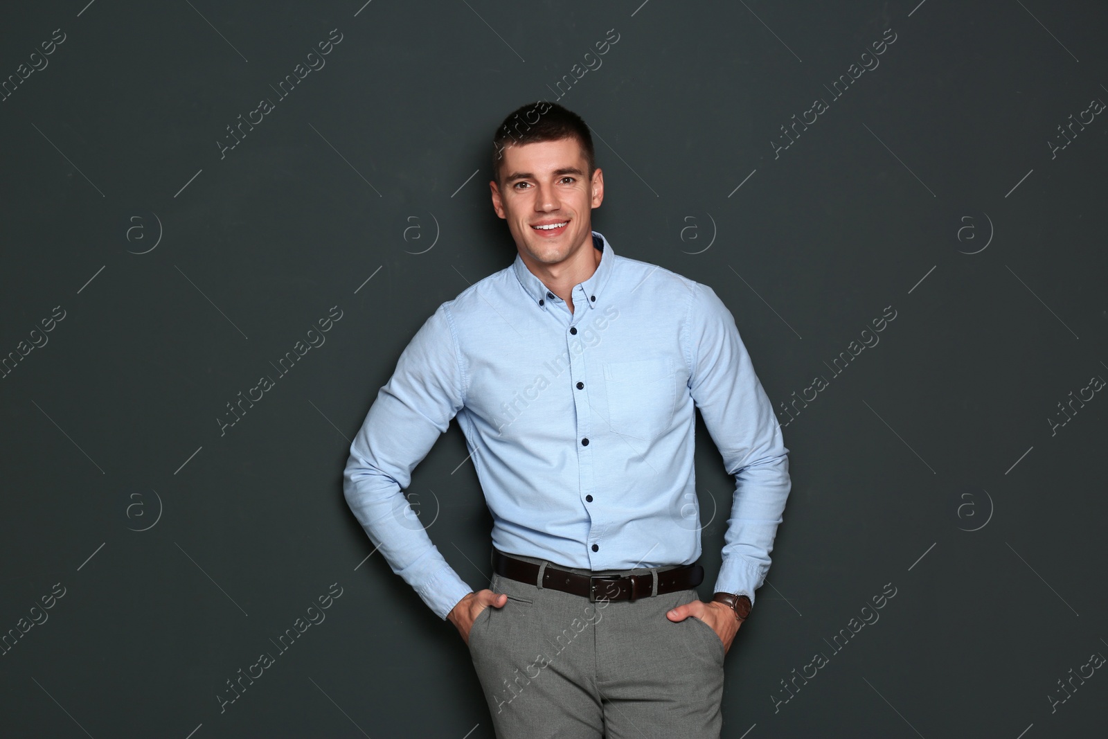 Photo of Portrait of handsome young man on dark background