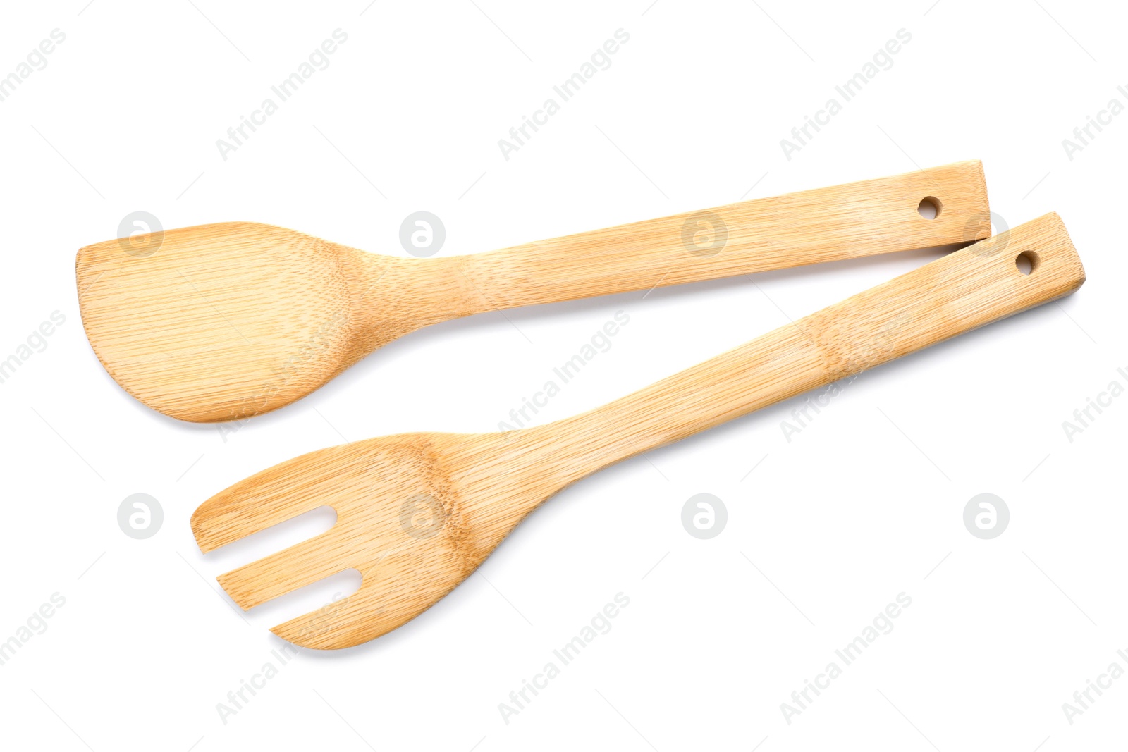 Photo of Kitchen utensils made of bamboo on white background, top view