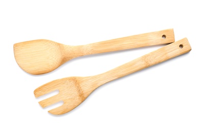 Kitchen utensils made of bamboo on white background, top view