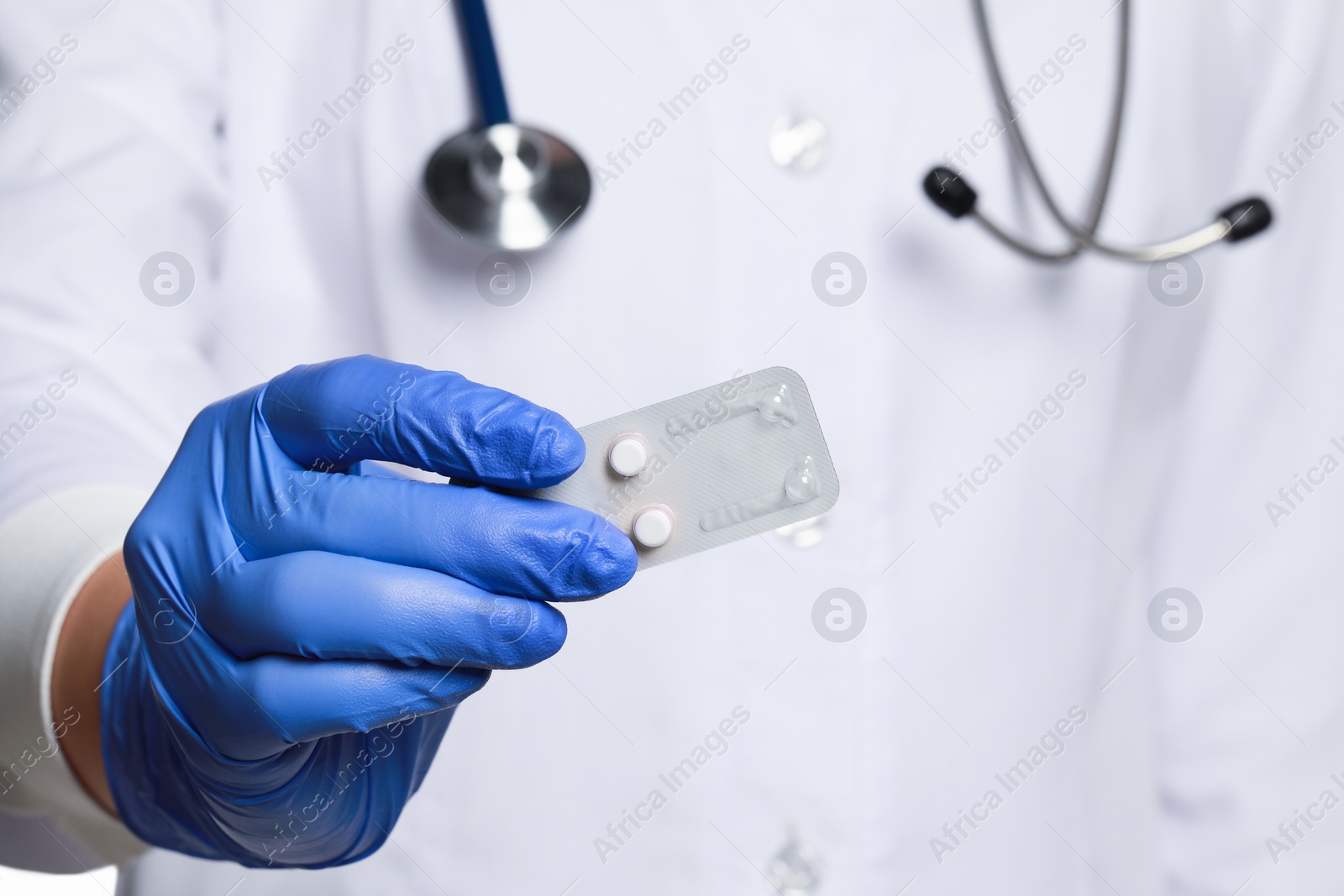 Photo of Doctor holding blister of emergency contraception pills, closeup