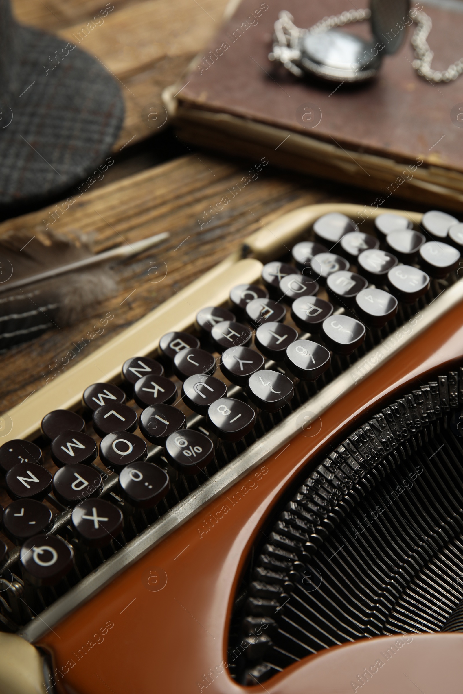 Photo of Typewriter on wooden table, closeup. Detective's workplace