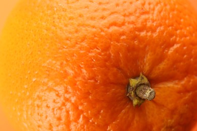 Photo of Delicious unpeeled orange fruit as background, closeup